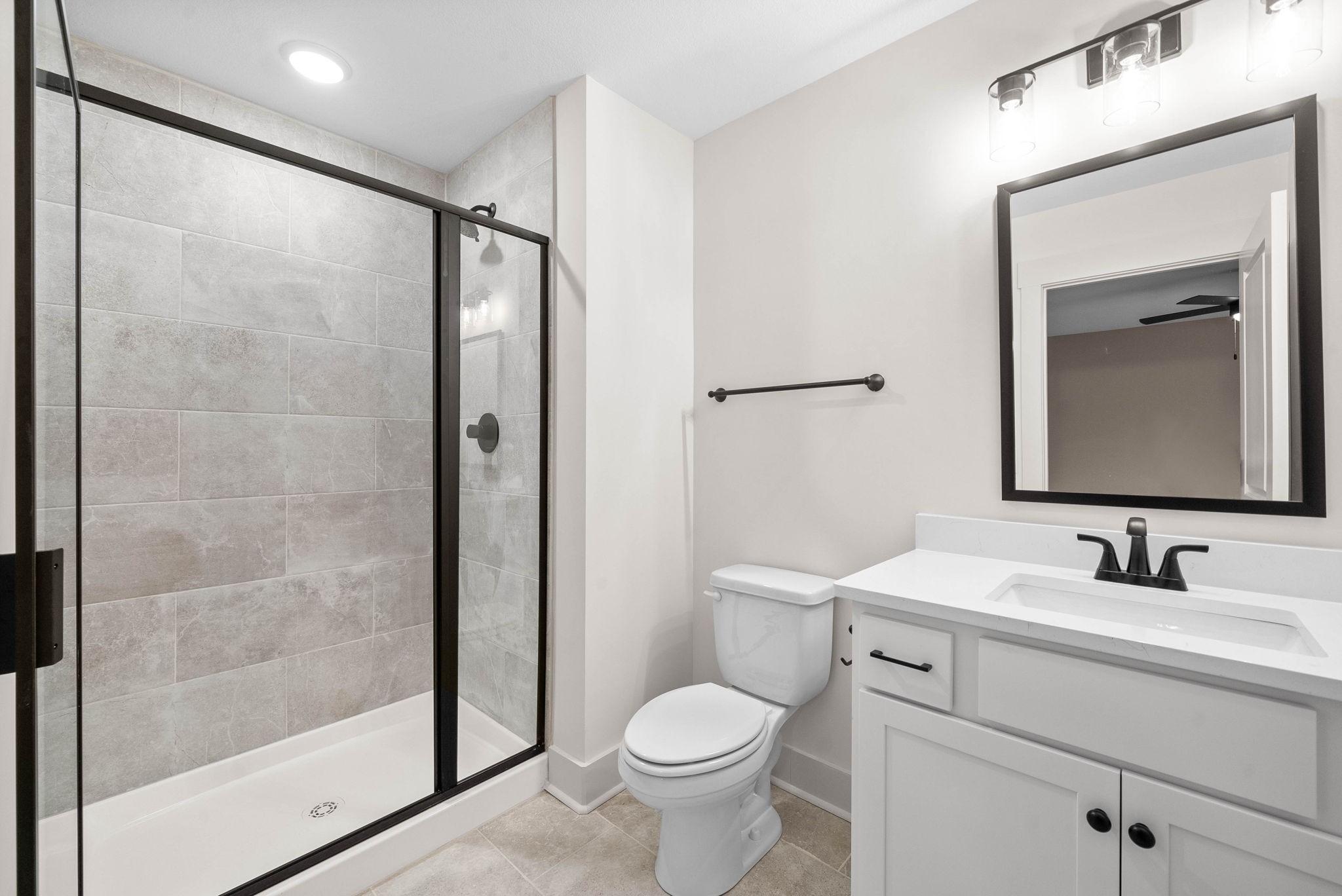 193 Dewberry Road Clarksville, TN 37042 - Photo 21 of 30 a bathroom with a shower sink vanity mirror and toilet