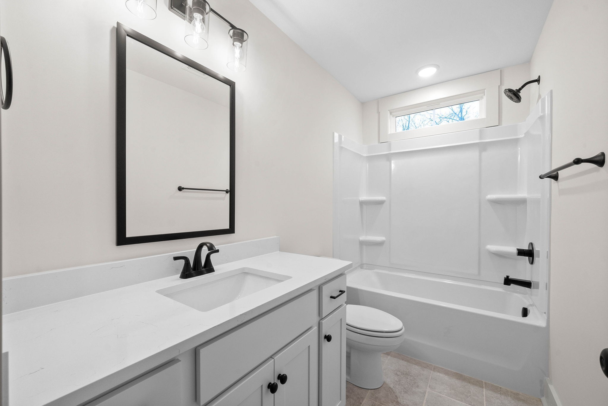 193 Dewberry Road Clarksville, TN 37042 - Photo 25 of 30 a bathroom with a sink a toilet and shower