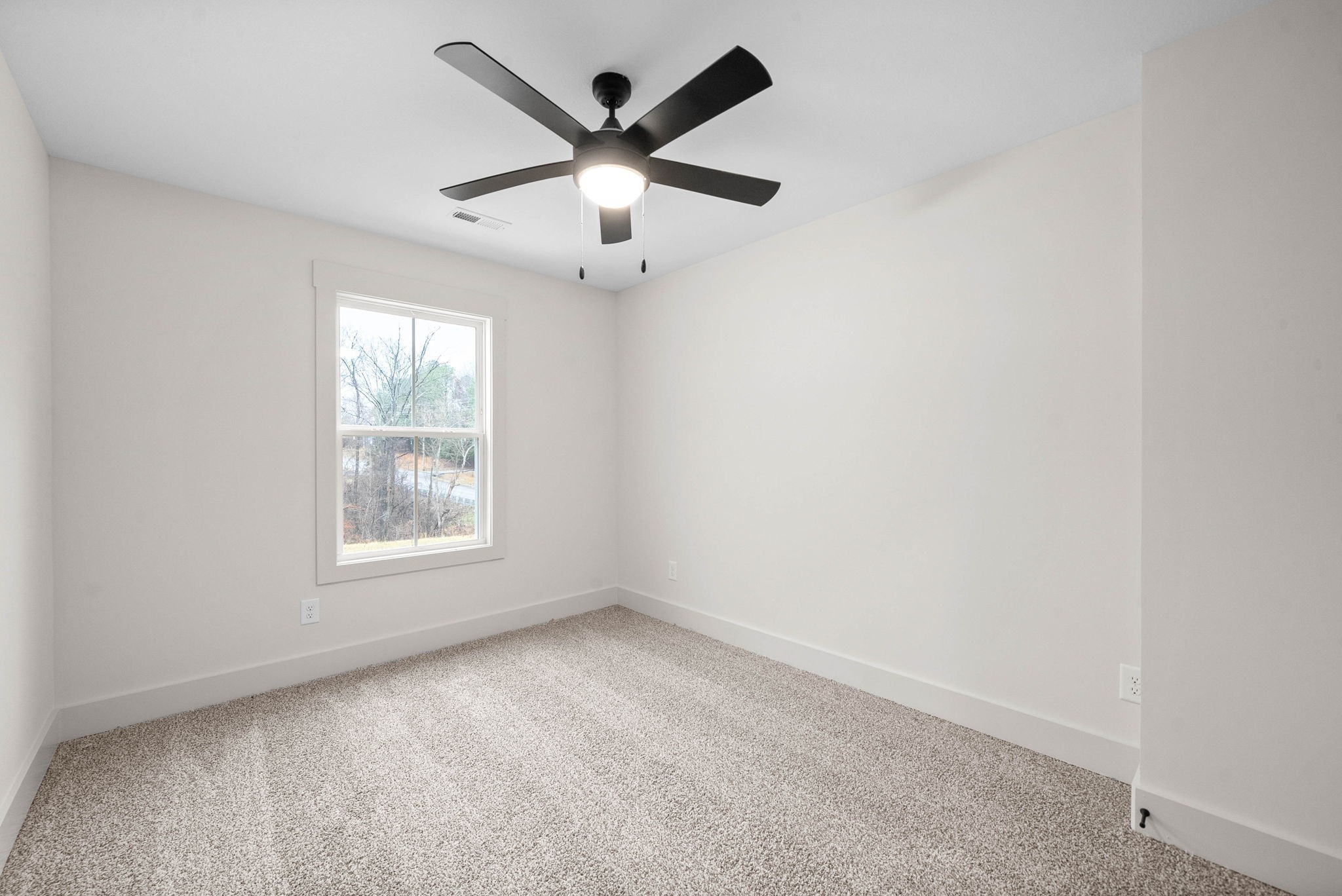 193 Dewberry Road Clarksville, TN 37042 - Photo 27 of 30 an empty room with a window and a fan