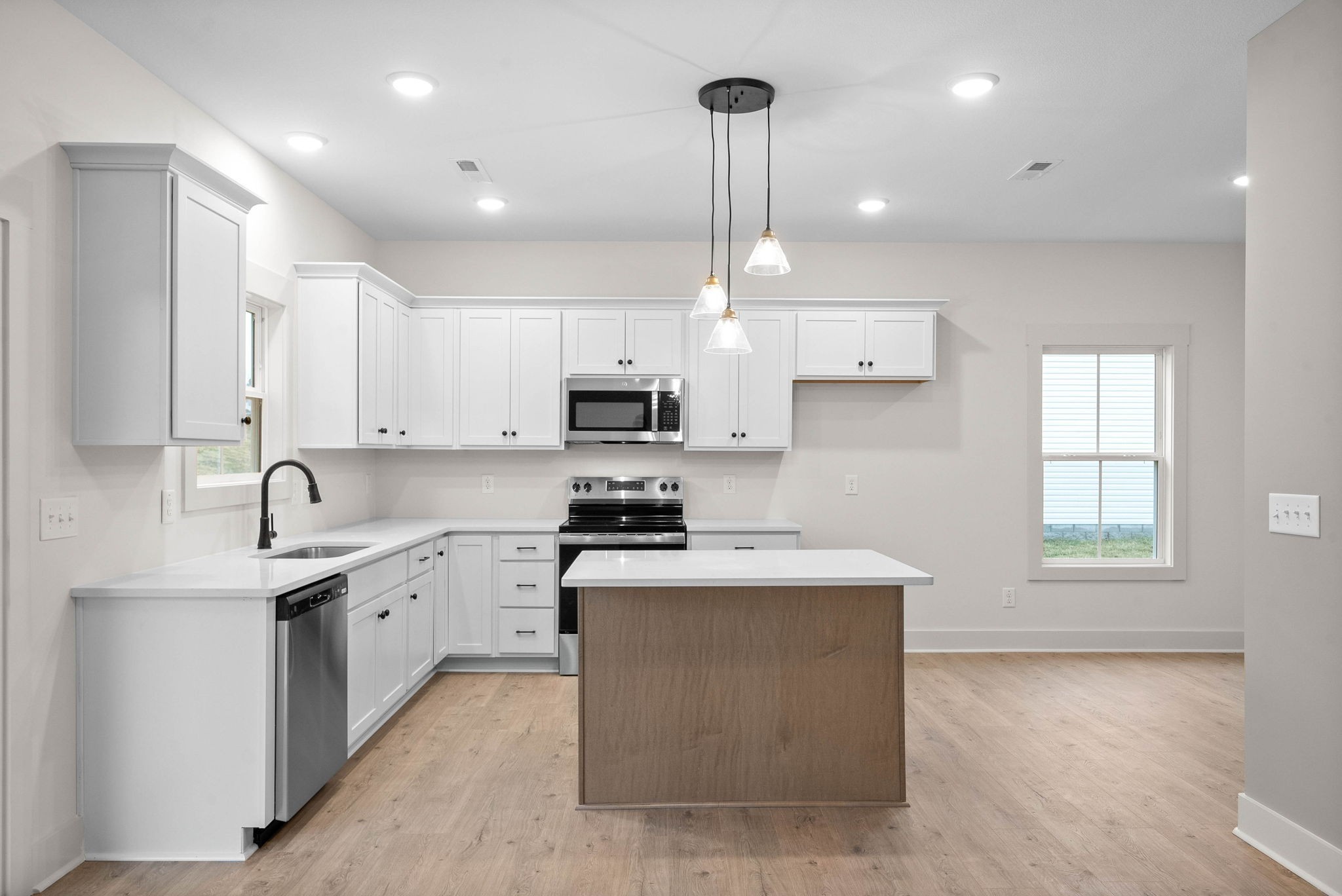 193 Dewberry Road Clarksville, TN 37042 - Photo 9 of 30 a kitchen with stainless steel appliances granite countertop a sink a stove and a refrigerator