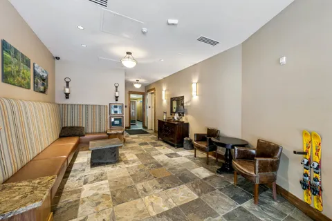 a living room with furniture and a rug