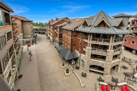 a front view of a residential apartment building with a yard