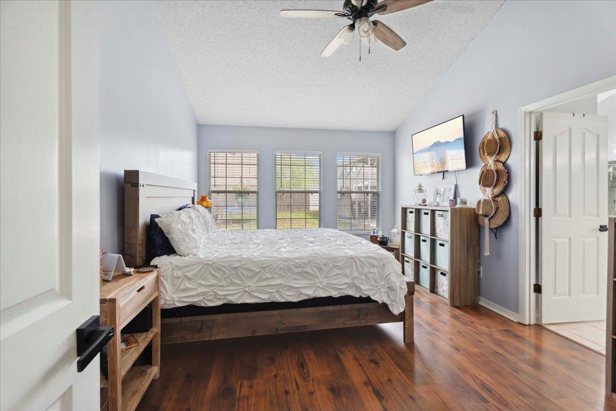 536 Moultrie Wells Road St. Augustine, FL 32086 - Photo 18 of 40 a bedroom with a bed and wooden floor