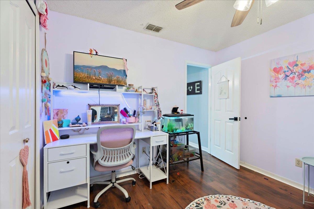 536 Moultrie Wells Road St. Augustine, FL 32086 - Photo 24 of 40 a workspace with furniture and wooden floor