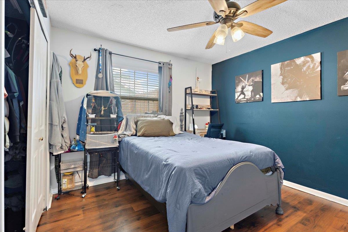536 Moultrie Wells Road St. Augustine, FL 32086 - Photo 25 of 40 a bedroom with a bed and a chandelier