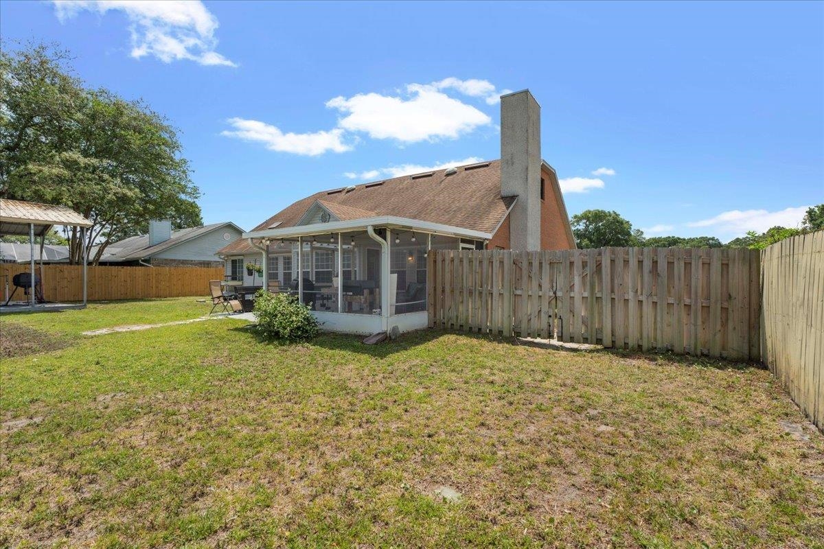 536 Moultrie Wells Road St. Augustine, FL 32086 - Photo 33 of 40 a view of a house with a yard