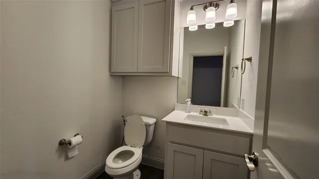 a kitchen with refrigerator and windows