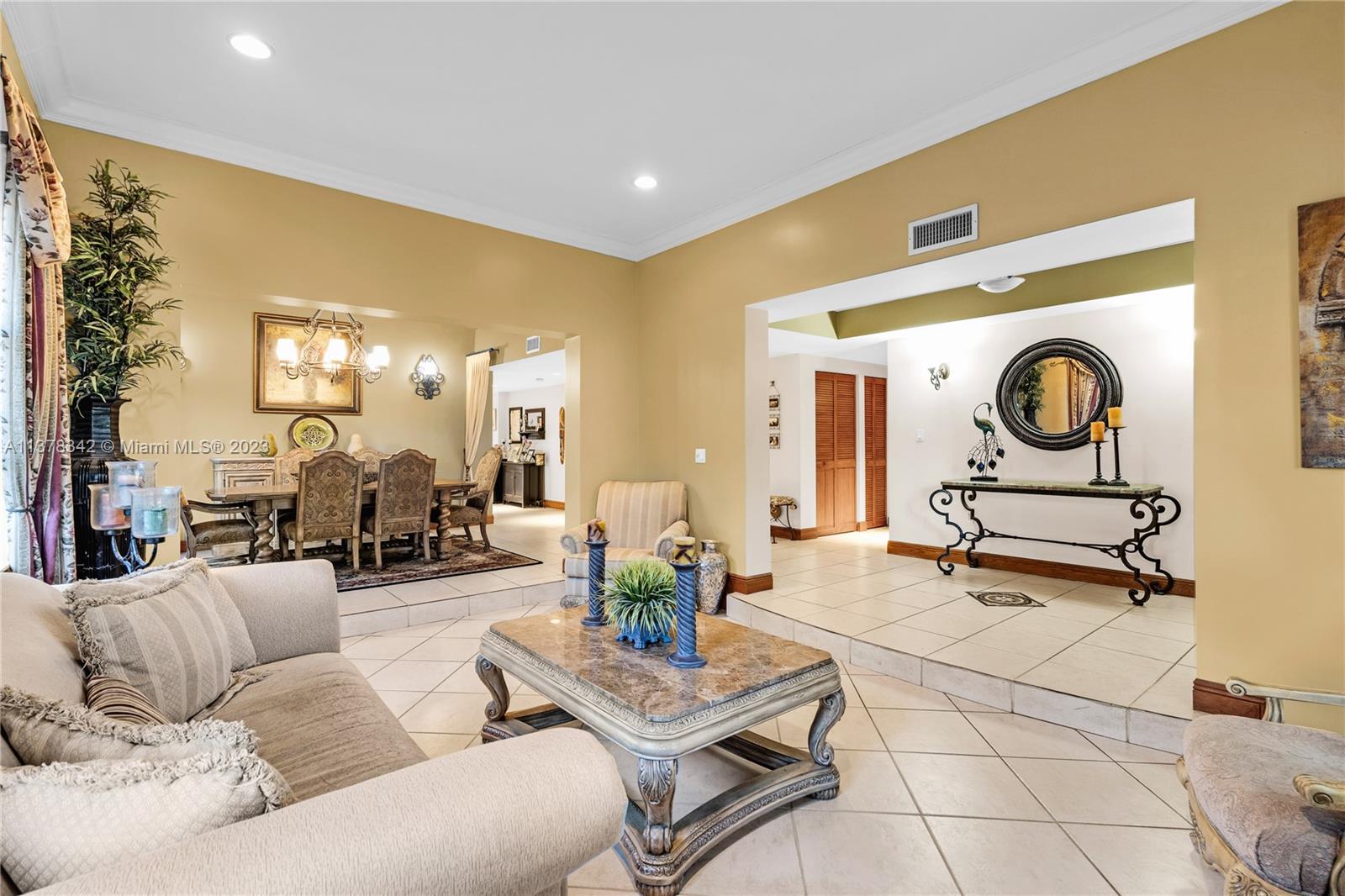 428 Southwest 19th Road Miami, FL 33129 - Photo 6 of 38 a living room with furniture and a mirror