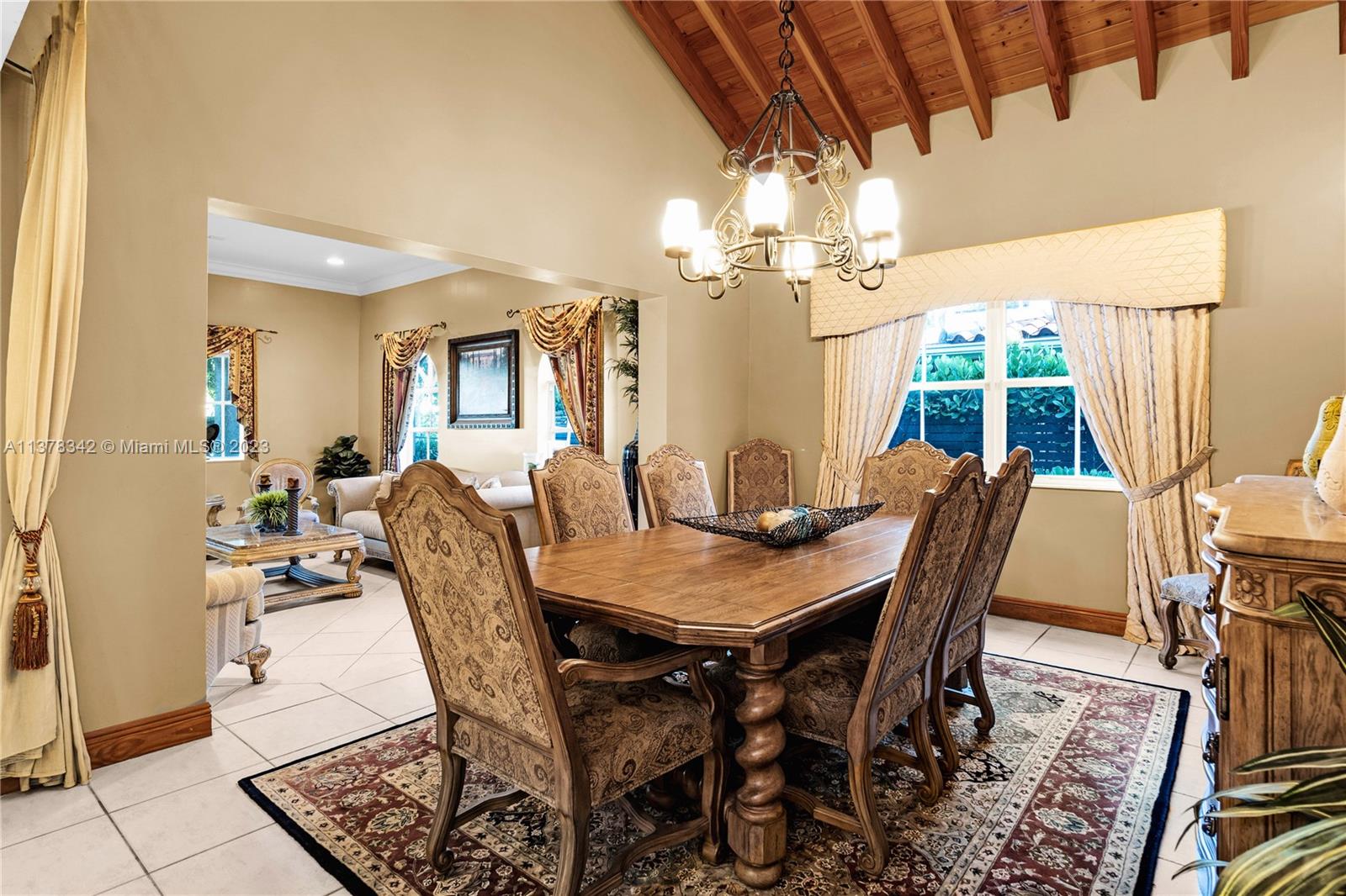 428 Southwest 19th Road Miami, FL 33129 - Photo 8 of 38 a view of a dining room with furniture and a chandelier
