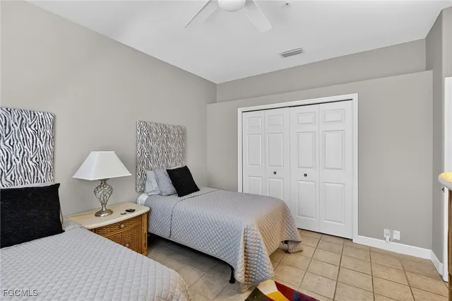 a bedroom with a bed and a lamp