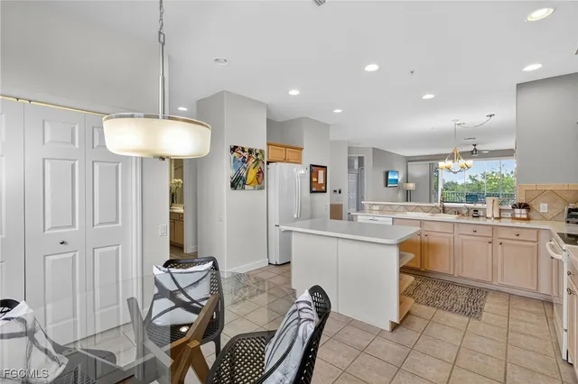 a kitchen with sink cabinets and window