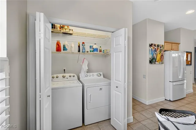 a view of storage and utility room with washer and dryer