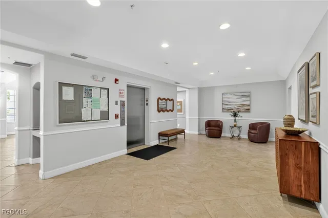 a view of a livingroom with furniture and a window