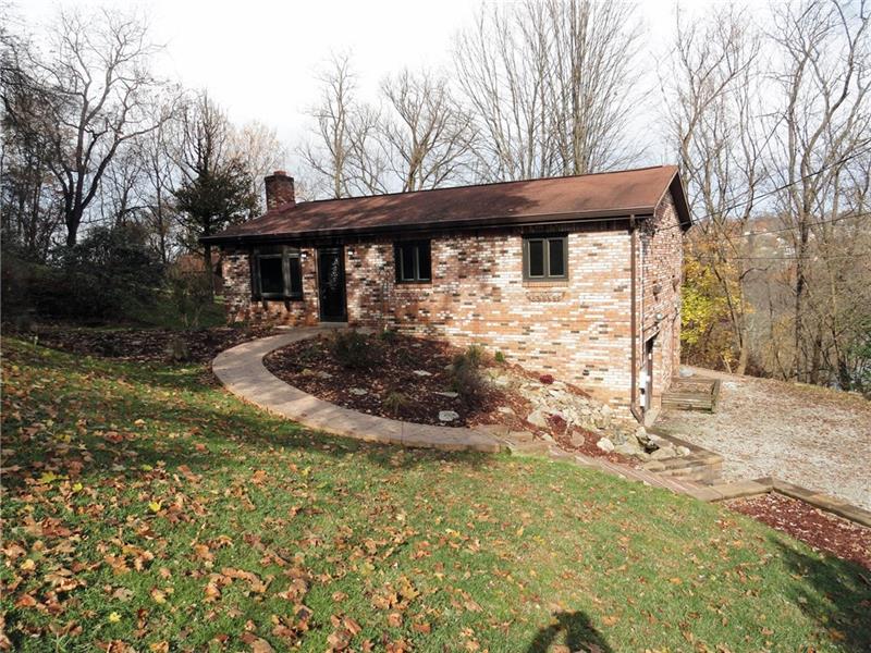 All brick ranch in private setting on approximately 2/3 of an acre