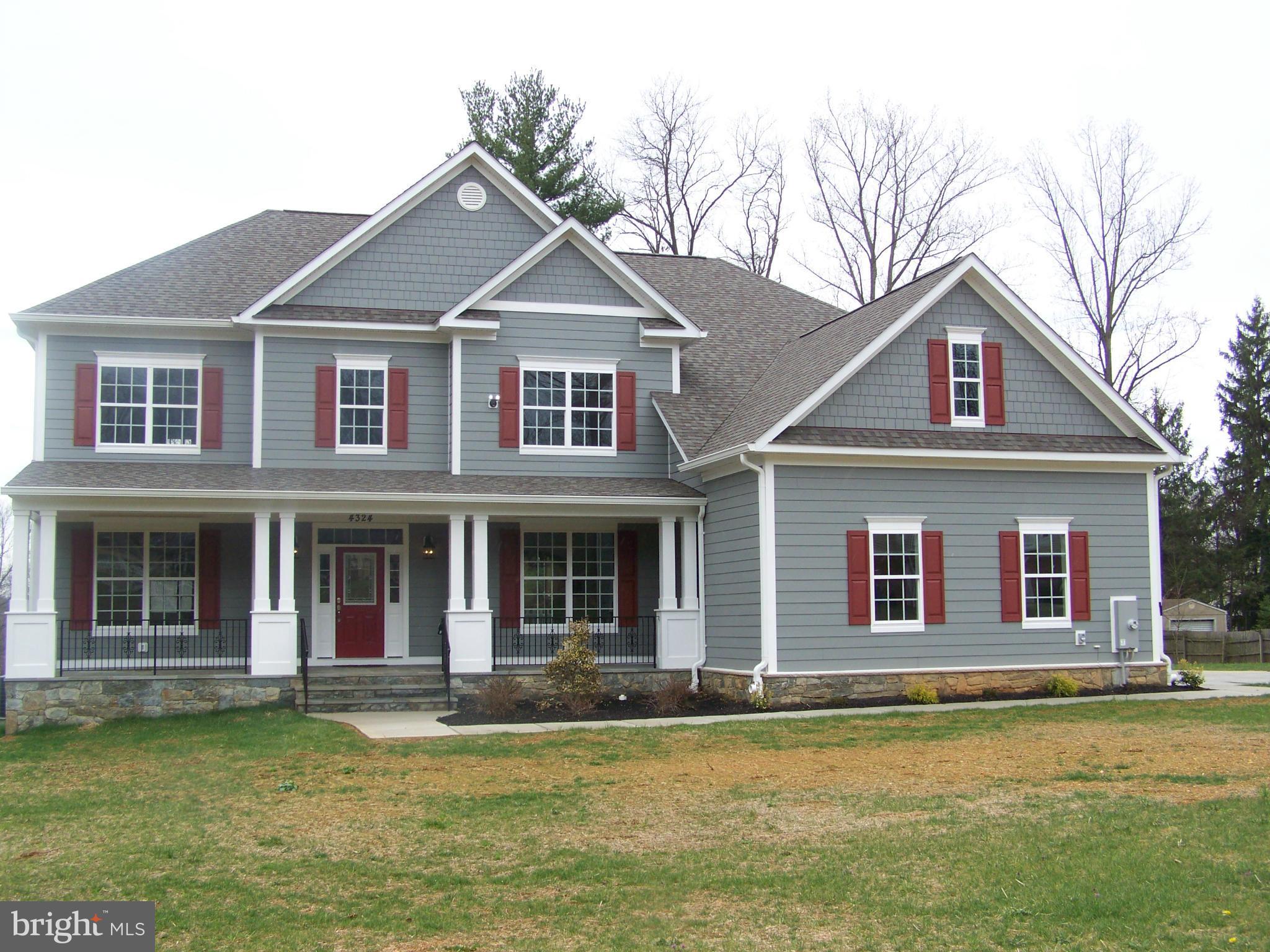 4324 Holly Ridge Road Rockville, MD 20853 - Photo 1 of 16 a front view of a house with a garden
