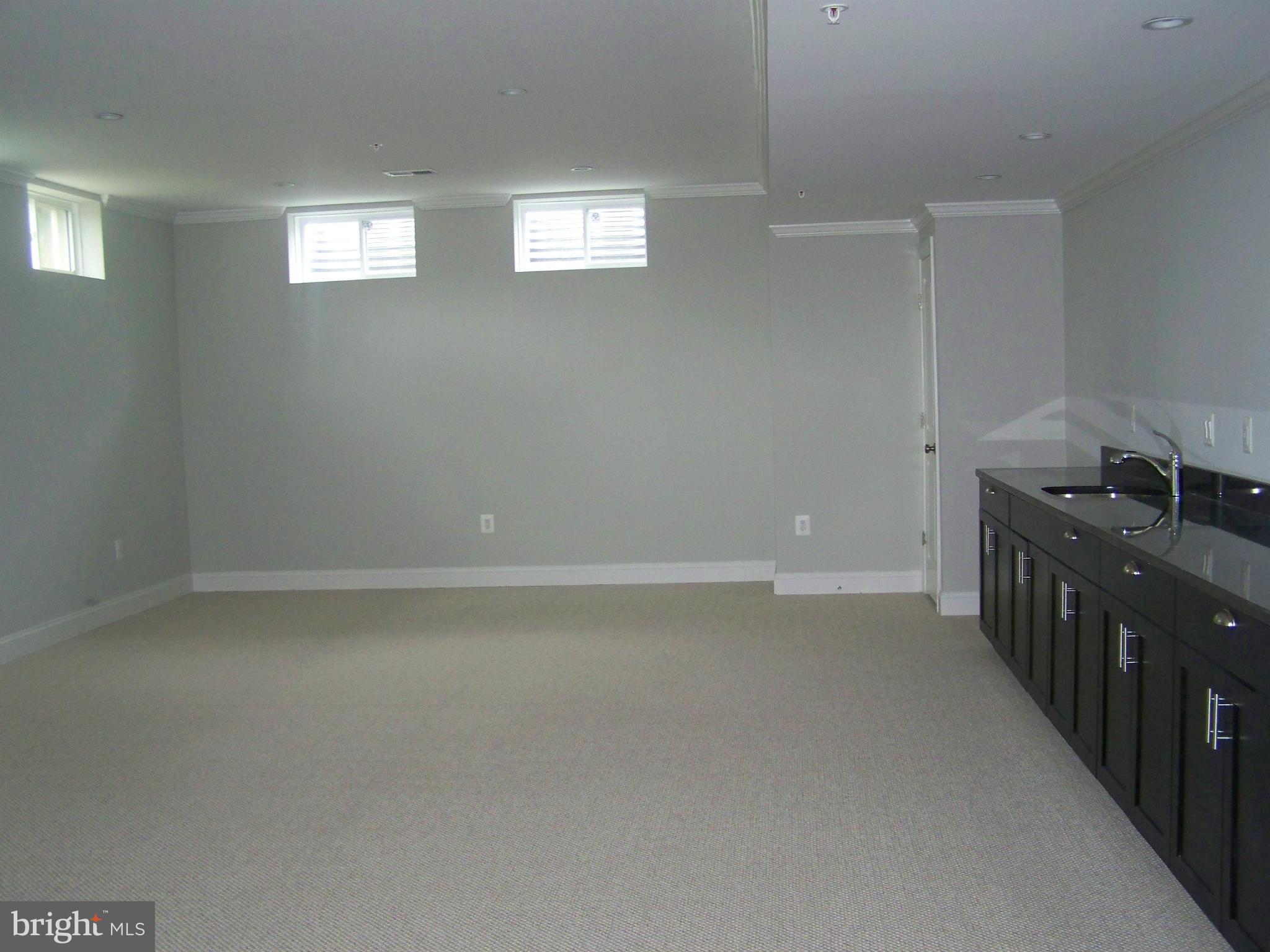 4324 Holly Ridge Road Rockville, MD 20853 - Photo 14 of 16 a kitchen that has a lot of cabinets