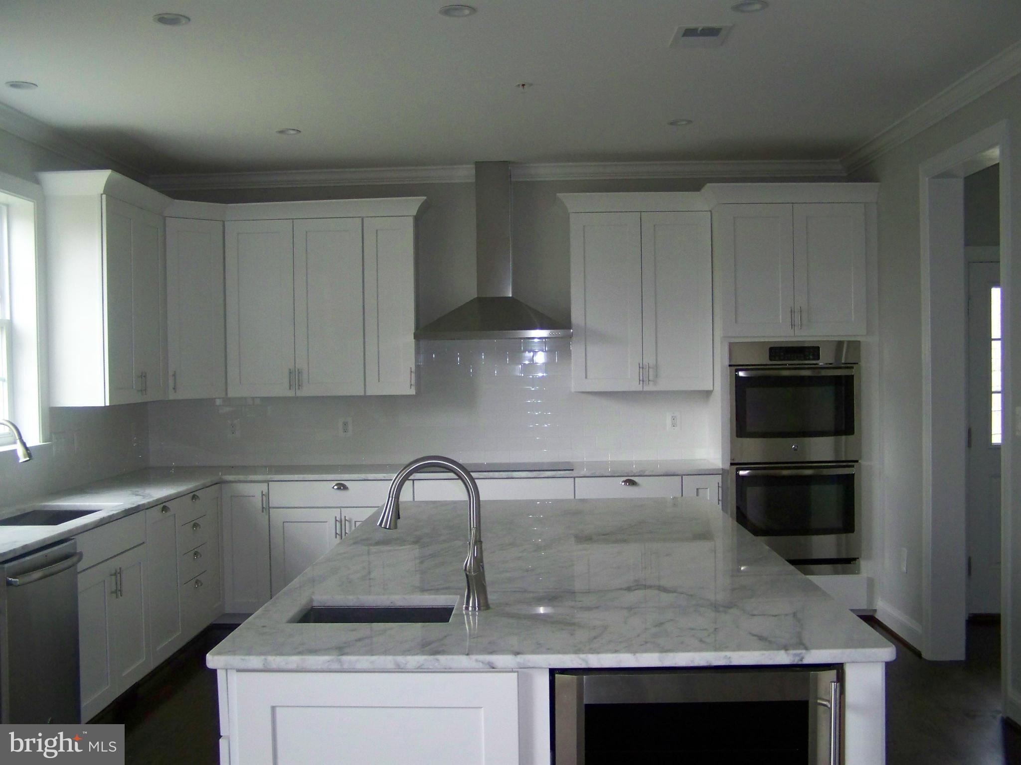 4324 Holly Ridge Road Rockville, MD 20853 - Photo 6 of 16 a kitchen with a sink and cabinets