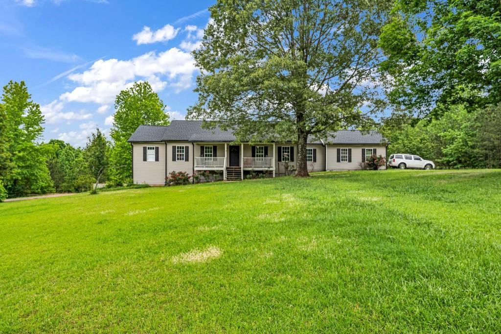 8926 East Carroll Road Winston, GA 30187 - Photo 1 of 1 a view of house with yard and outdoor seating