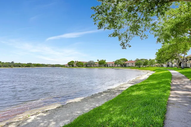 a view of a lake with a big yard