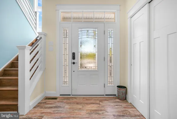 a kitchen with cabinets appliances and a window