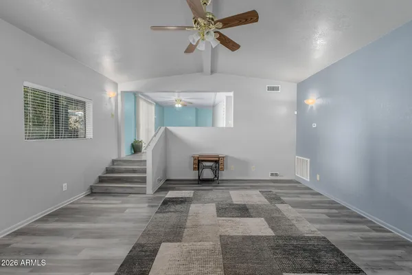 a view of entryway and hall with a front door