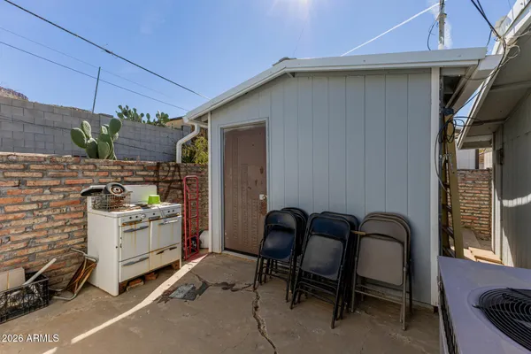 a view of a patio in the backyard
