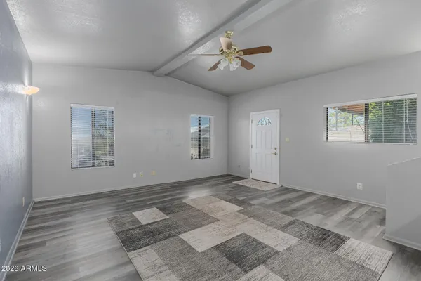 a view of an empty room with a window