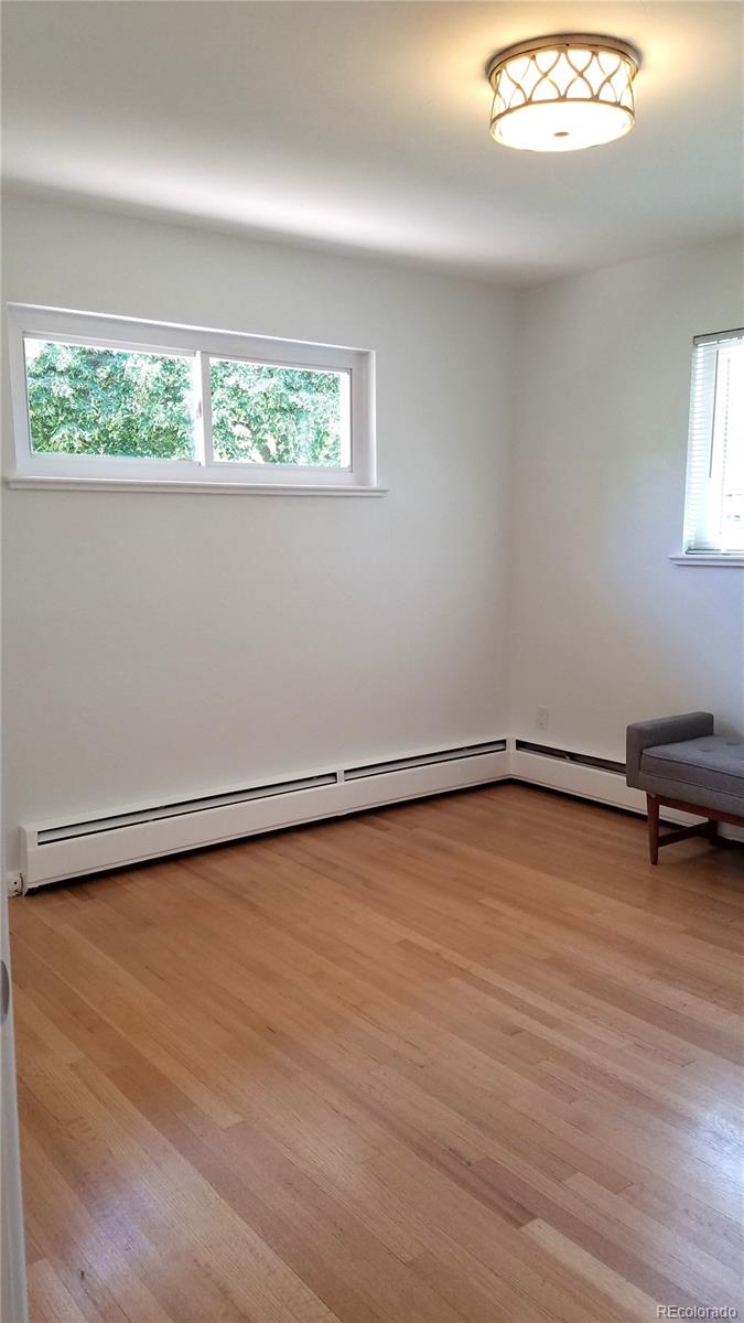 4630 Quay Street Wheat Ridge, CO 80033 - Photo 25 of 36 a view of a room with wooden floor and a window