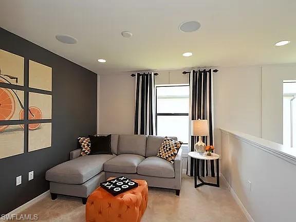 4085 Spotted Eagle Way Fort Myers, FL 33966 - Photo 10 of 12 a living room with furniture and a large window