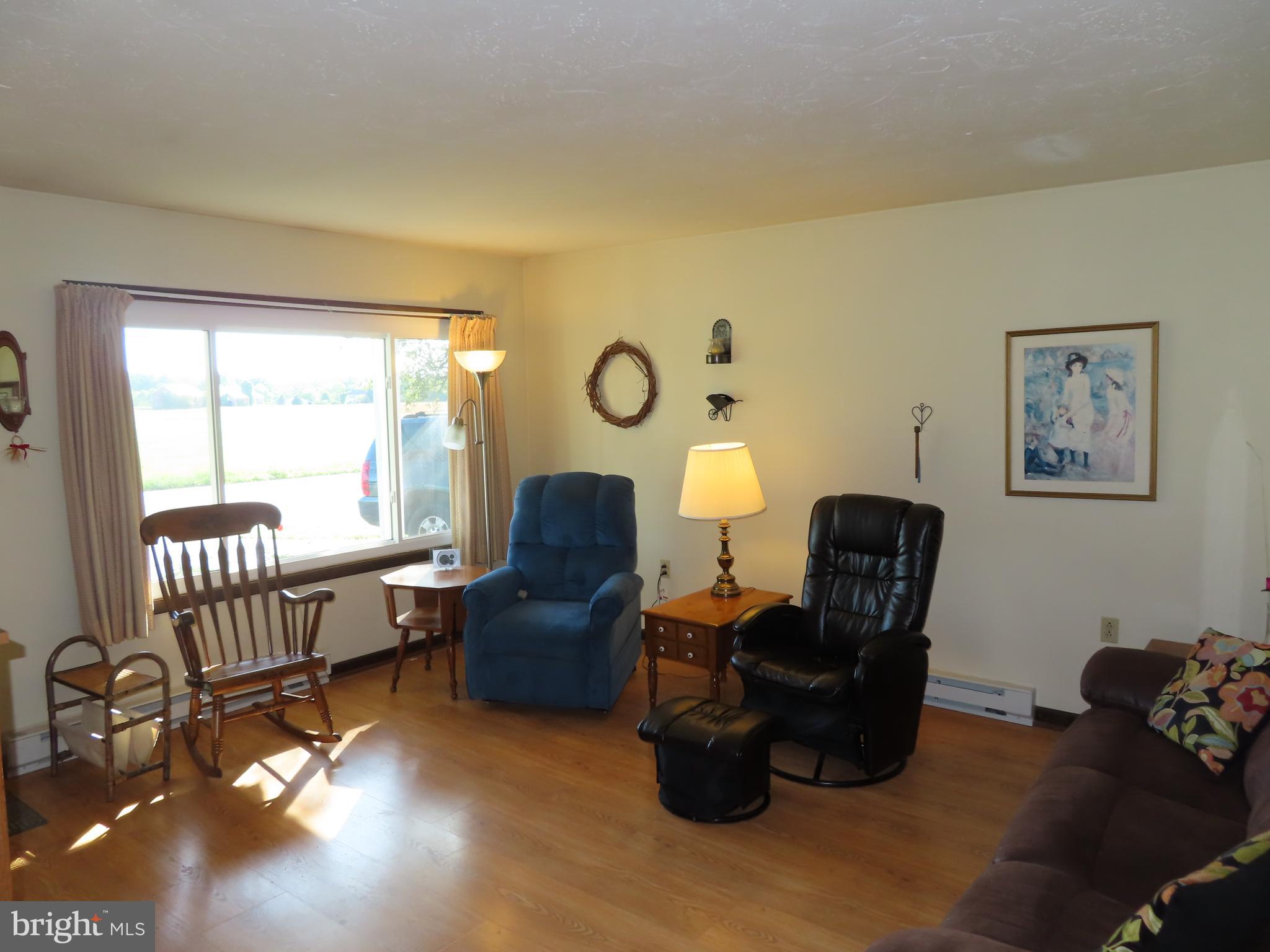 3338 Centennial Road Hanover, PA 17331 - Photo 13 of 30 a living room with furniture rug and a window