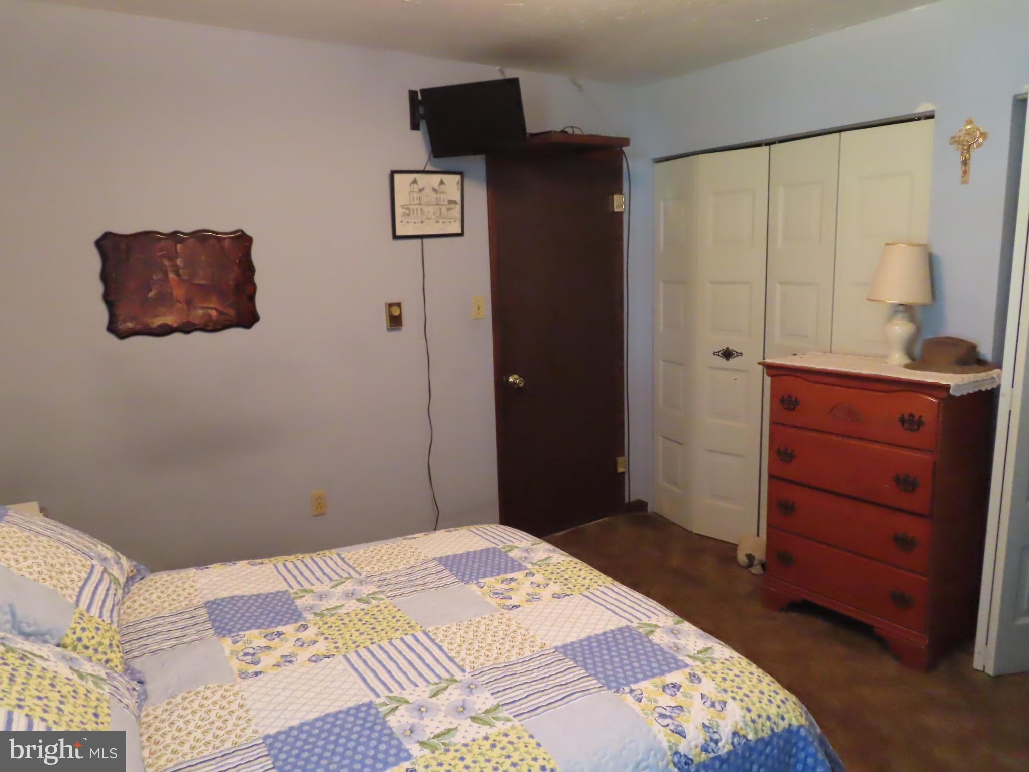 3338 Centennial Road Hanover, PA 17331 - Photo 17 of 30 a bedroom with a bed and cabinets