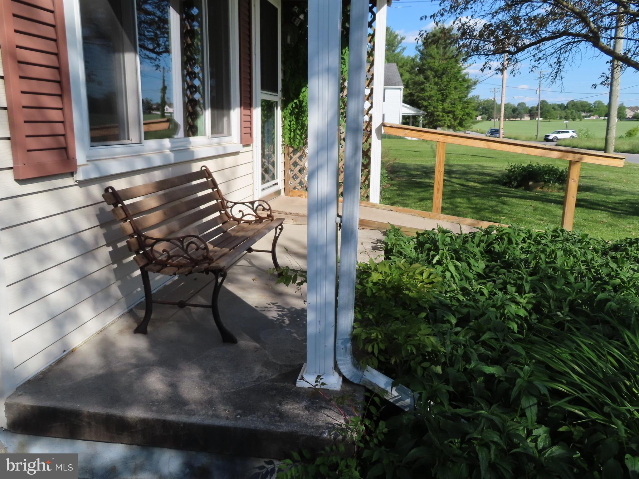 3338 Centennial Road Hanover, PA 17331 - Photo 3 of 30 a view of a patio with table and chairs and potted plants
