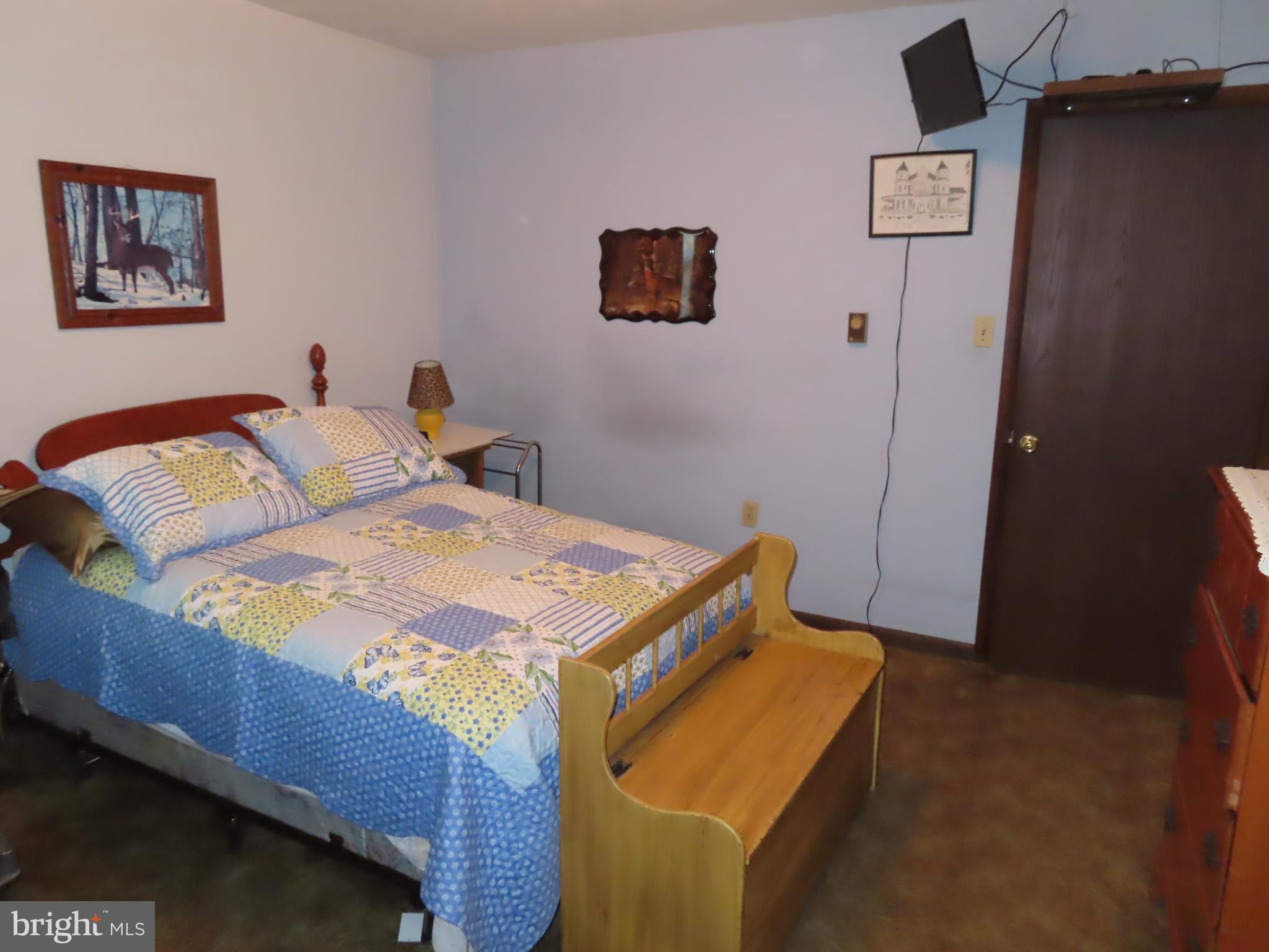 3338 Centennial Road Hanover, PA 17331 - Photo 21 of 30 a bedroom with a bed and hallway