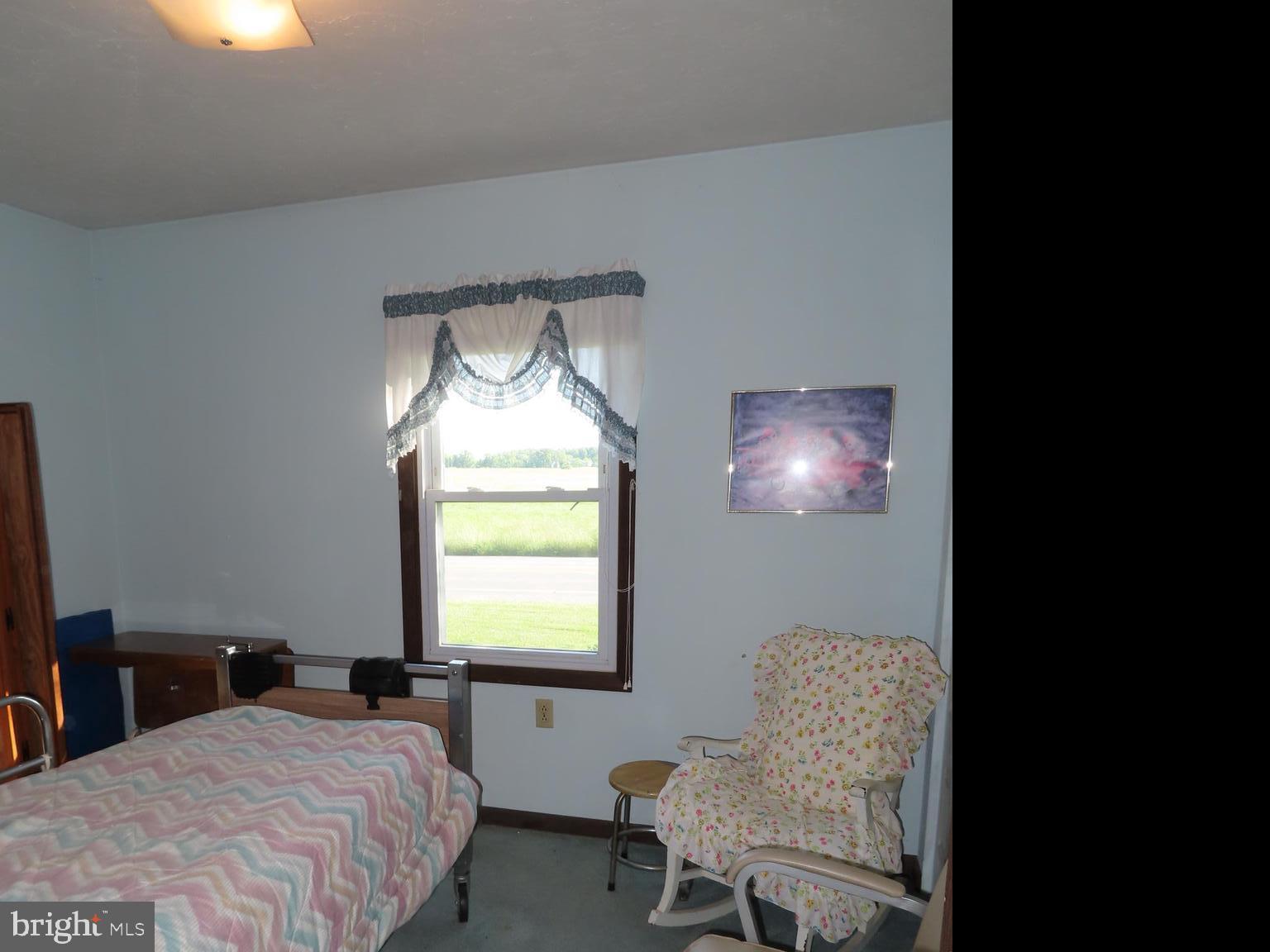 3338 Centennial Road Hanover, PA 17331 - Photo 23 of 30 a bedroom with a bed and a chair