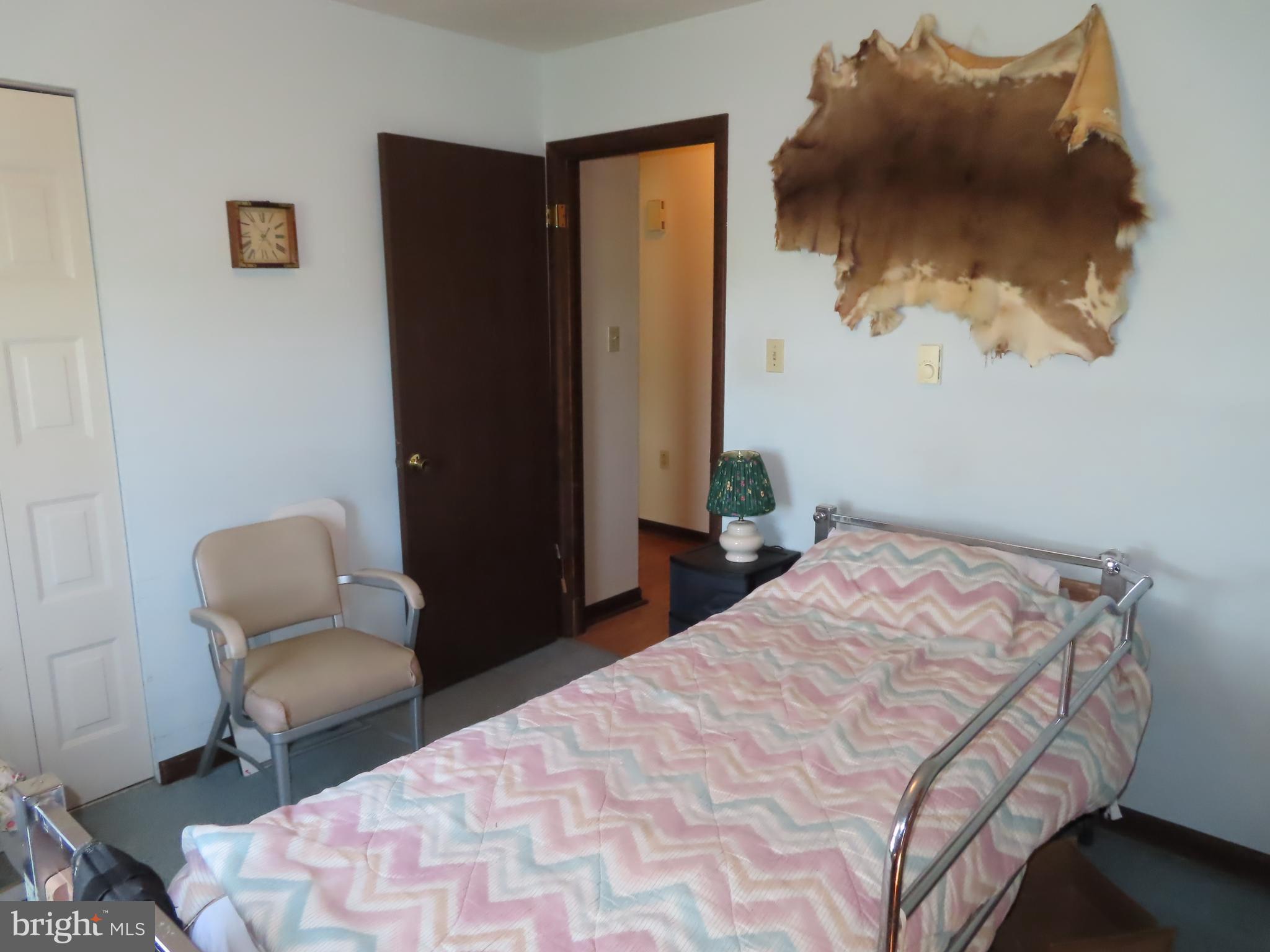 3338 Centennial Road Hanover, PA 17331 - Photo 24 of 30 a bedroom with a bed and a chair