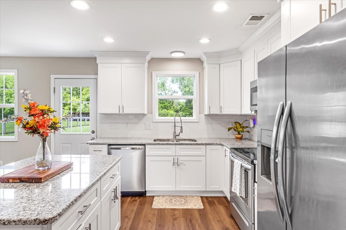 147 Ray Jent Road Bethpage, TN 37022 - Photo 15 of 47 a kitchen with a sink refrigerator and window