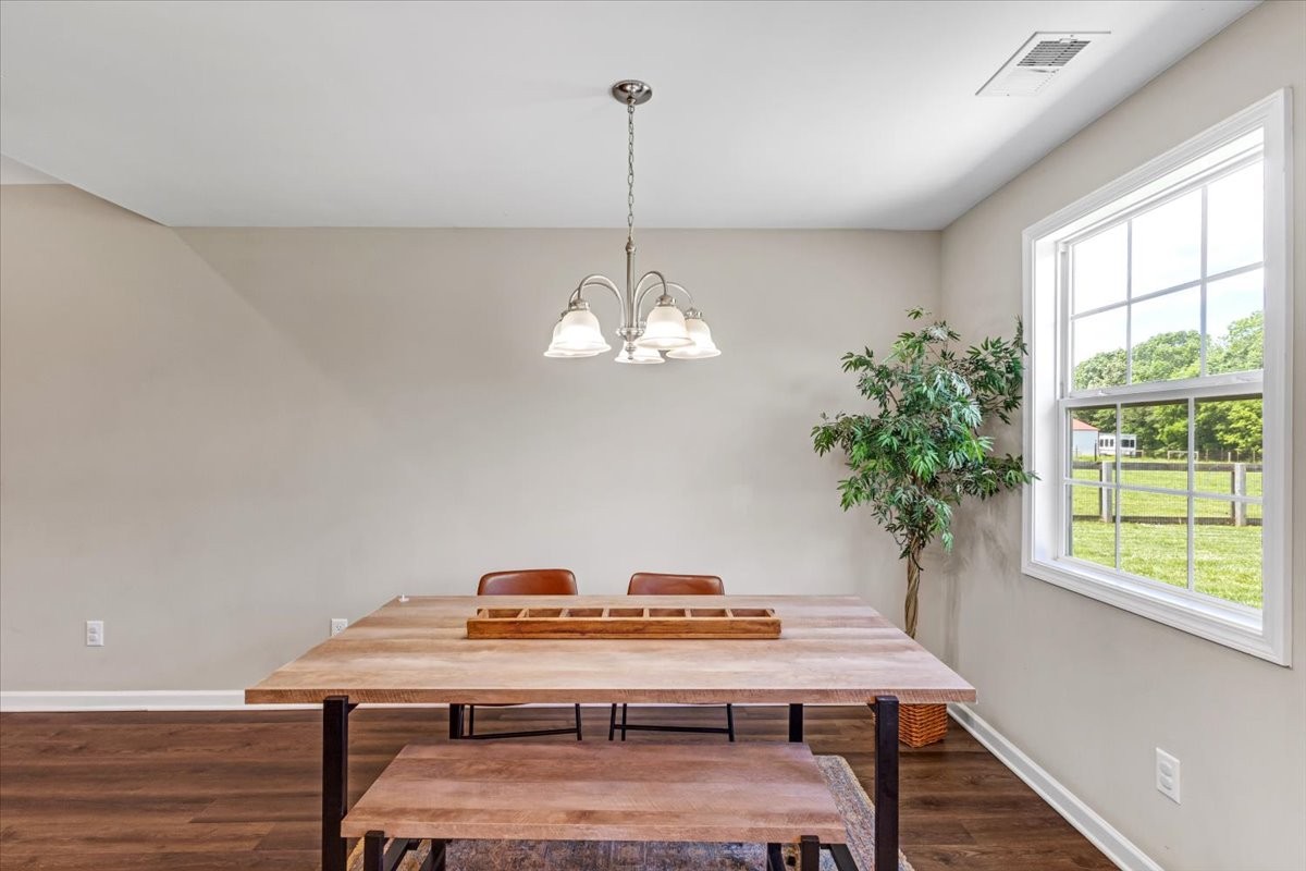 147 Ray Jent Road Bethpage, TN 37022 - Photo 20 of 47 a view of a dining room with furniture window and wooden floor