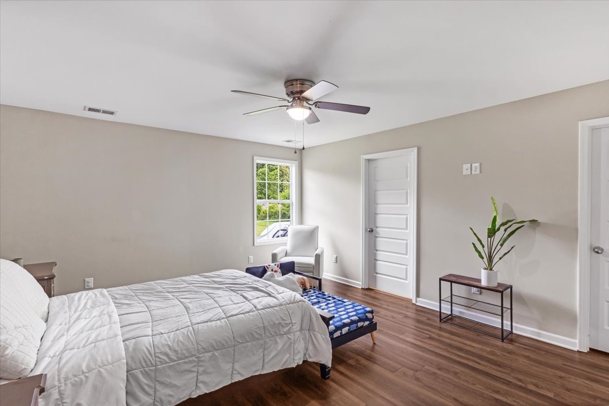 147 Ray Jent Road Bethpage, TN 37022 - Photo 23 of 47 a bedroom with a bed and wooden floor