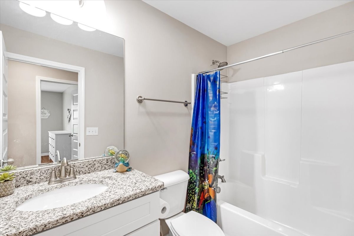 147 Ray Jent Road Bethpage, TN 37022 - Photo 27 of 47 a bathroom with a granite countertop sink toilet and shower
