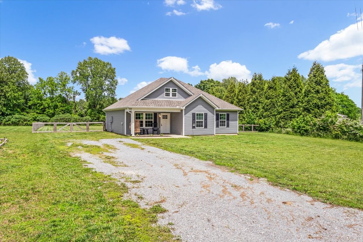 147 Ray Jent Road Bethpage, TN 37022 - Photo 5 of 47 a front view of a house with garden