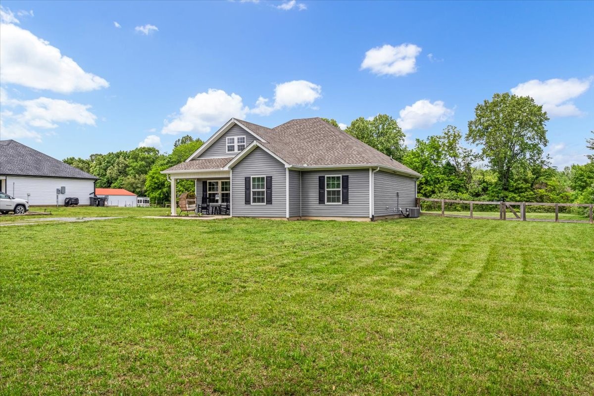147 Ray Jent Road Bethpage, TN 37022 - Photo 6 of 47 a front view of a house with a garden and yard