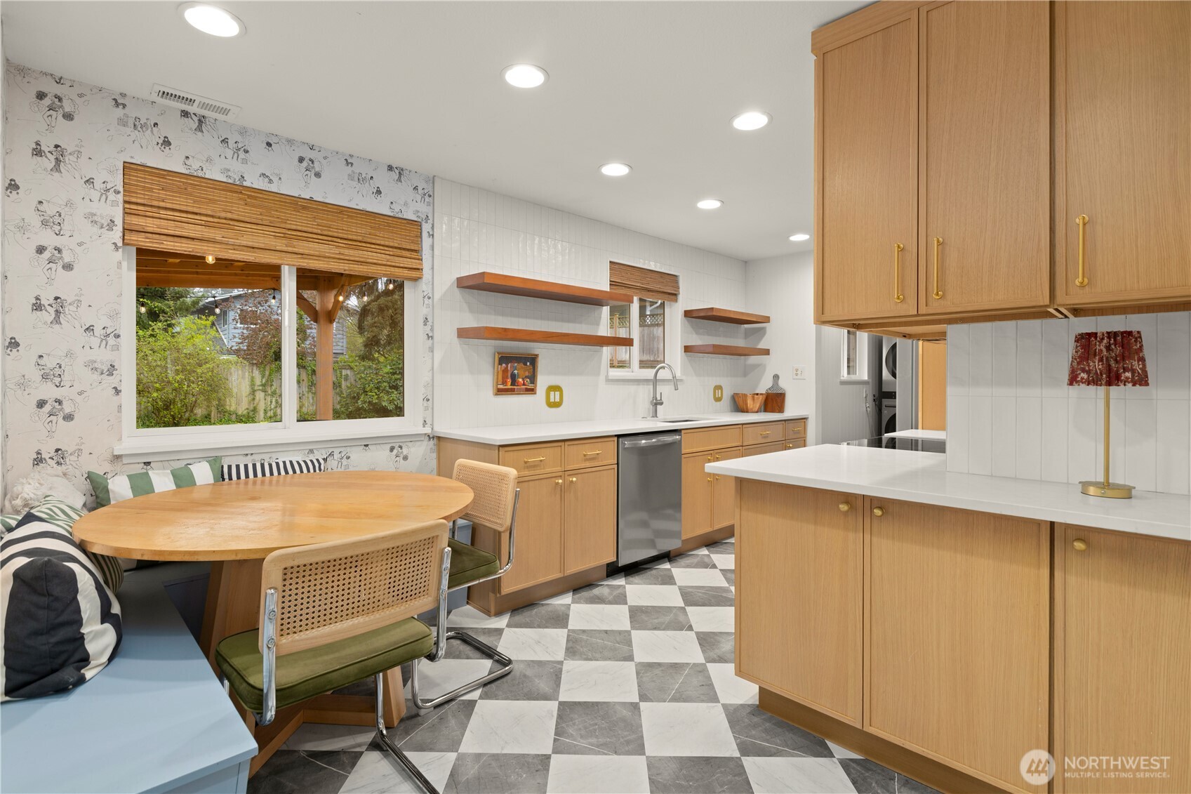 1259 North 173rd Street Shoreline, WA 98133 - Photo 12 of 37 a kitchen with a sink and chairs