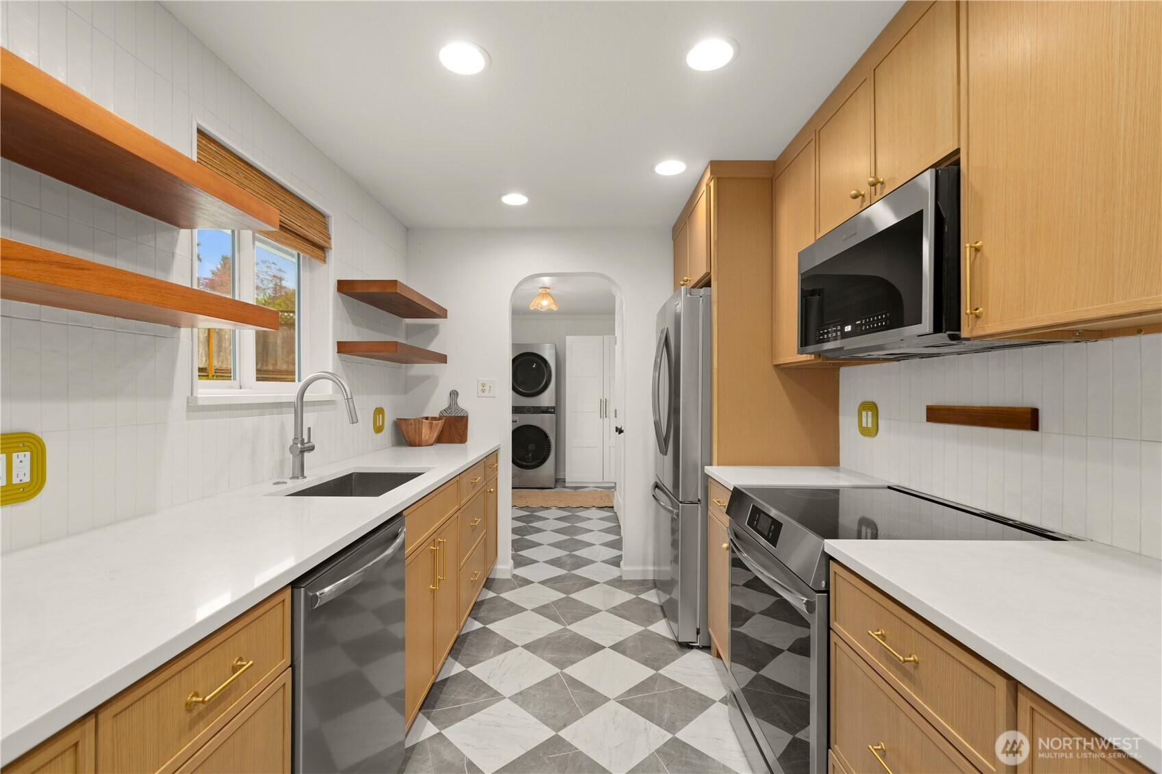 1259 North 173rd Street Shoreline, WA 98133 - Photo 15 of 37 a kitchen with a sink a stove and cabinets