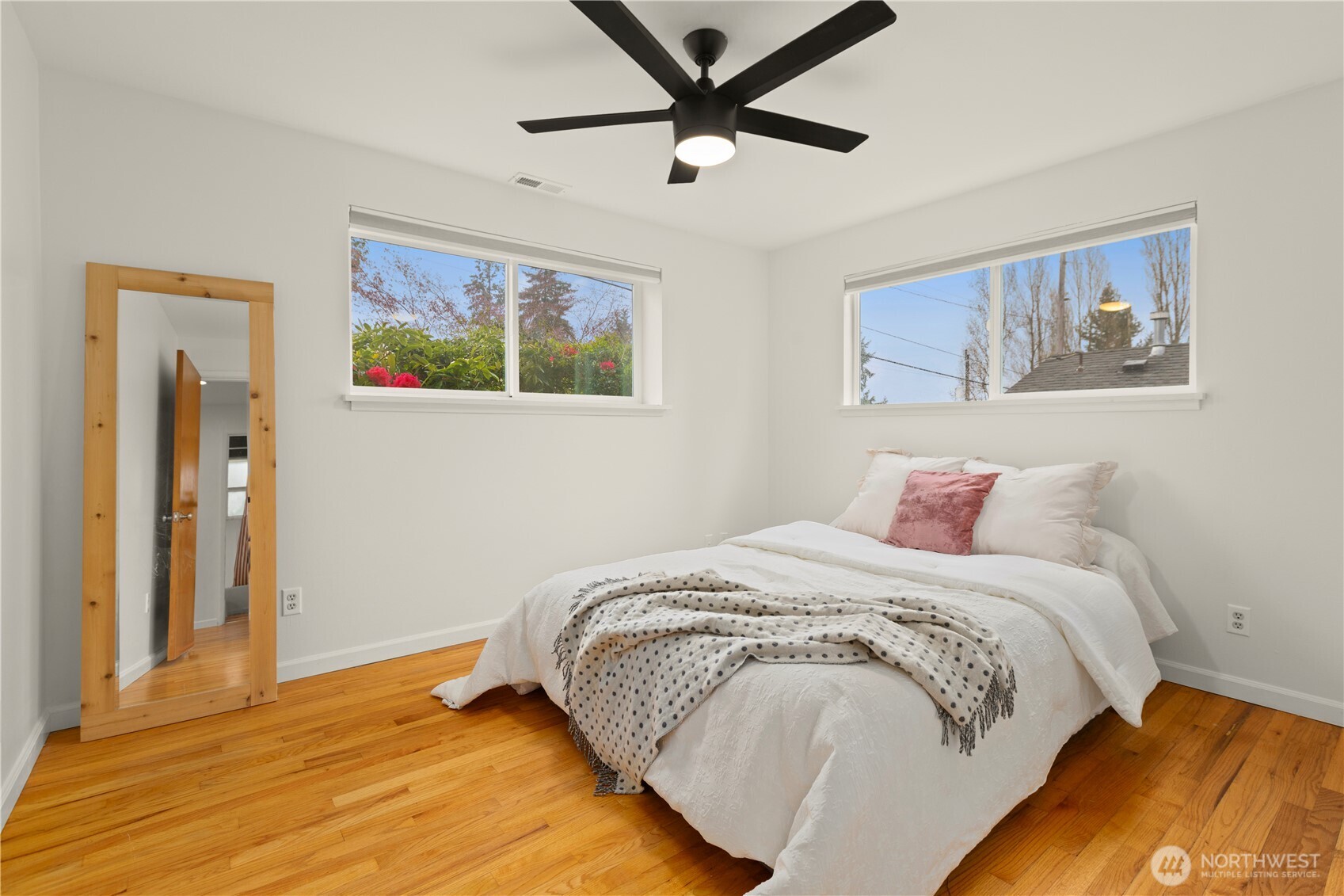 1259 North 173rd Street Shoreline, WA 98133 - Photo 20 of 37 a bedroom with a bed and a painting on the wall