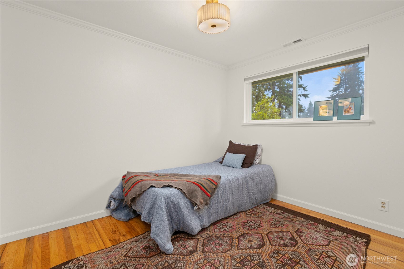 1259 North 173rd Street Shoreline, WA 98133 - Photo 22 of 37 a bedroom with a bed and cupboard