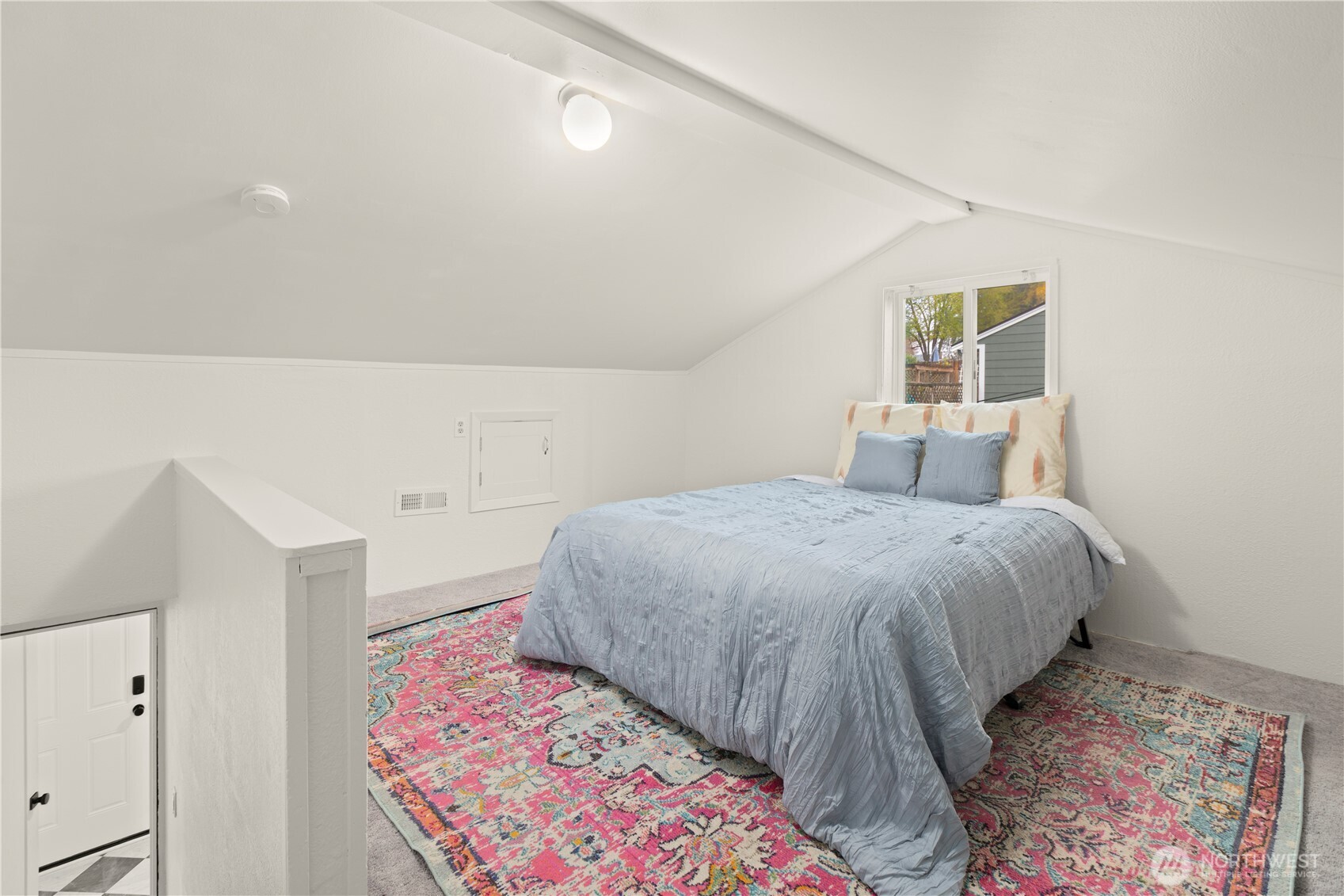 1259 North 173rd Street Shoreline, WA 98133 - Photo 26 of 37 a bedroom with a bed and a painting on the wall