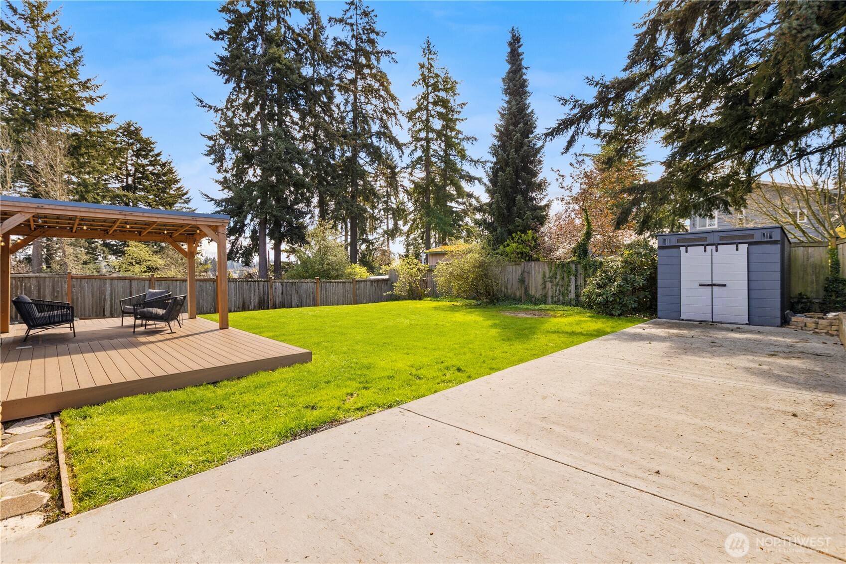 1259 North 173rd Street Shoreline, WA 98133 - Photo 31 of 37 a view of a house with garden and trees