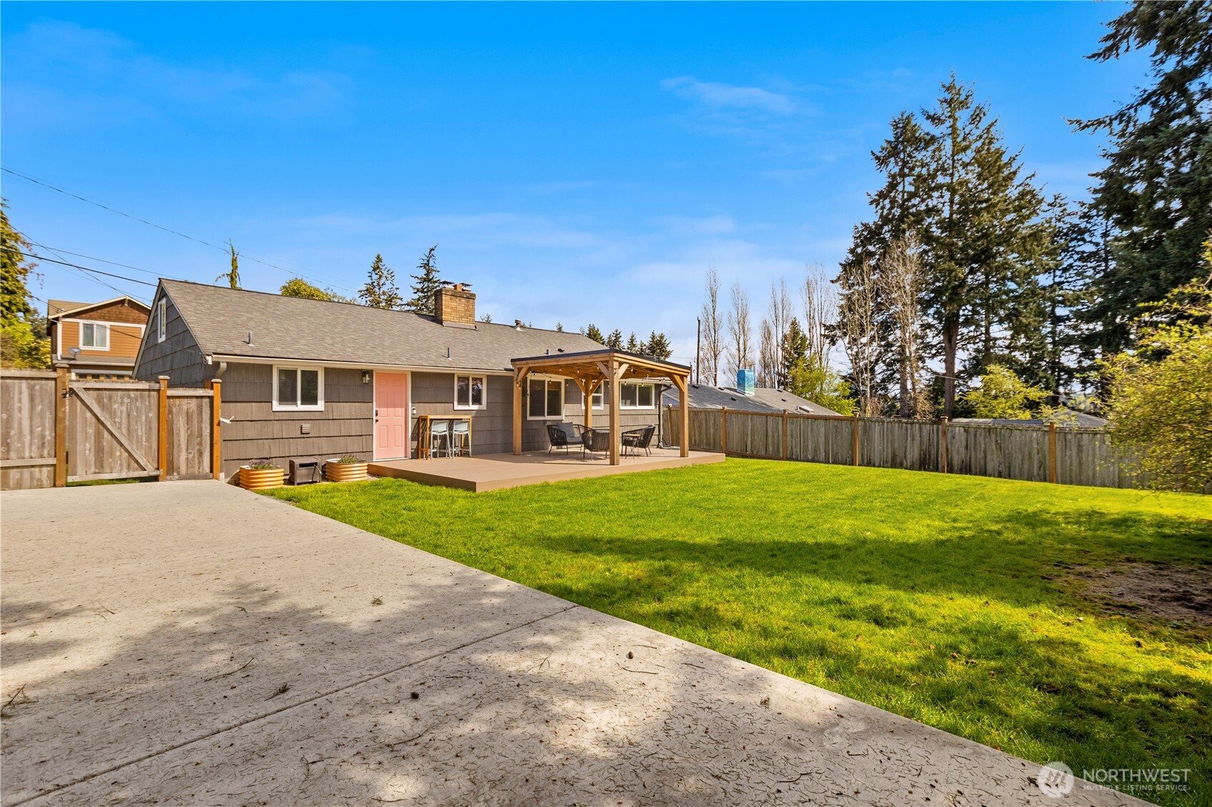 1259 North 173rd Street Shoreline, WA 98133 - Photo 32 of 37 a front view of a house with a yard