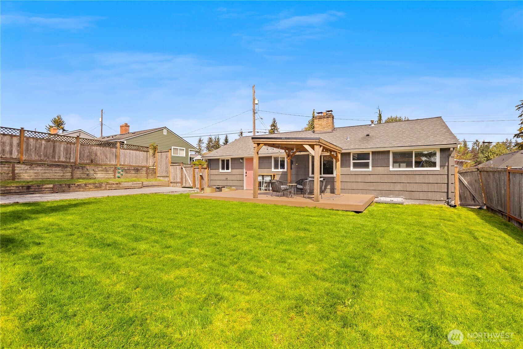1259 North 173rd Street Shoreline, WA 98133 - Photo 33 of 37 a view of a house with a big yard and large trees
