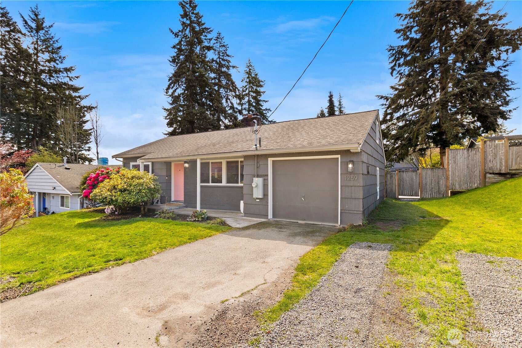 1259 North 173rd Street Shoreline, WA 98133 - Photo 36 of 37 a view of a house with a yard and garage